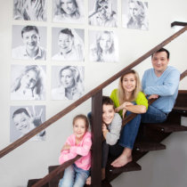 Family photos on the wall. Portraits of family stairwell